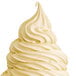 A white soft serve swirl on a large ice cream cone.