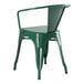 A Lancaster Table & Seating emerald green metal outdoor arm chair with a backrest.