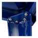 A close up of a blue metal Lancaster Table & Seating outdoor table with metal screws.