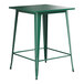 A Lancaster Table & Seating emerald green metal bar table with a square top.
