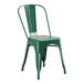 A Lancaster Table & Seating green metal cafe chair.