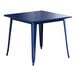 A blue square Lancaster Table & Seating outdoor table with legs.