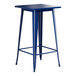 A blue Lancaster Table & Seating outdoor table with legs and a square top.