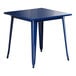 A blue square Lancaster Table & Seating outdoor table with metal legs.