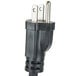A black power plug with two metal prongs plugged into a Cecilware electric fryer.