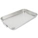 A silver rectangular aluminum roasting pan with handles.