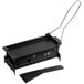 A black rectangular grill with a spatula and tongs.