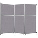 A Versare Cloud Gray fabric room divider with silver frame.
