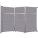 A grey Versare operable wall room divider with a silver frame.