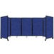 A blue rectangular Versare SoundSorb room divider with black lines on wheels.