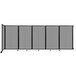 A Versare light gray room divider with wheels on it.