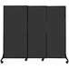 A black rectangular Versare Quick-Wall sliding room divider on wheels.