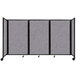 A Versare Cloud Gray foldable room divider with three panels.