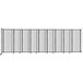 A clear poly Versare StraightWall wall-mounted room divider with black lines and clear panels.