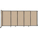 A Versare wall-mounted room divider with tan fabric panels.