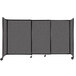 A Versare StraightWall sliding room divider in charcoal gray with wheels.