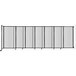 A clear poly Versare StraightWall wall-mounted room divider with a black frame.