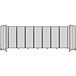 A Versare clear polycarbonate room divider with black metal frame.