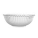 A clear polycarbonate bowl with a wavy edge.