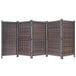 A close-up of a brown wicker partition with black accents.