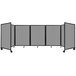 A Versare light gray polycarbonate room divider with a black frame and wheels.