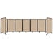 A tan Versare 3-panel room divider with black frame.