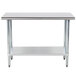 An Advance Tabco stainless steel work table with a galvanized undershelf.