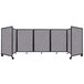A Versare foldable room divider with four grey panels.