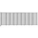 A clear Versare StraightWall wall-mounted room divider with black metal rods.