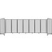 A Versare clear polycarbonate room divider with white panels and black metal frame.