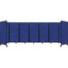 A group of blue Versare SoundSorb room dividers with black trim on wheels.