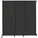 A black wall-mounted Versare Quick-Wall sliding room divider with wheels.