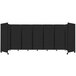 A black rectangular Versare SoundSorb room divider with wheels.
