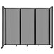 A light gray Versare room divider with four panels on wheels.