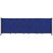 a blue wall with a black pole