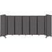 A Versare charcoal gray foldable room divider with four panels.