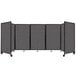 A Versare charcoal gray foldable room divider with four panels and a black frame.