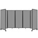 A Versare light gray room divider with wheels.