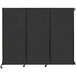 A black Versare wall-mounted folding room divider.