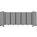 A Versare light gray polycarbonate room divider with wheels.
