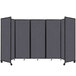 A dark gray Versare SoundSorb room divider with black trim on wheels.