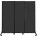 A black rectangular Versare room divider panel with wheels.