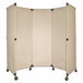 A beige Versare portable partition with wheels.