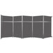 A Versare charcoal gray room divider with metal frame.