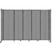 A light gray Versare StraightWall sliding room divider with black metal trim on wheels.
