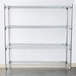 A Metro Super Erecta chrome wire shelf unit against a white wall.