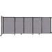 A Versare Cloud Gray StraightWall wall-mounted room divider with a black frame and grey fabric.