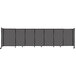 A Versare charcoal grey fabric room divider with wheels.