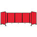 A red Versare polycarbonate folding room divider with wheels.