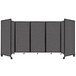 A Versare charcoal gray foldable room divider with four panels.